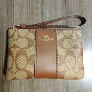 Brown leather Coach wristlet